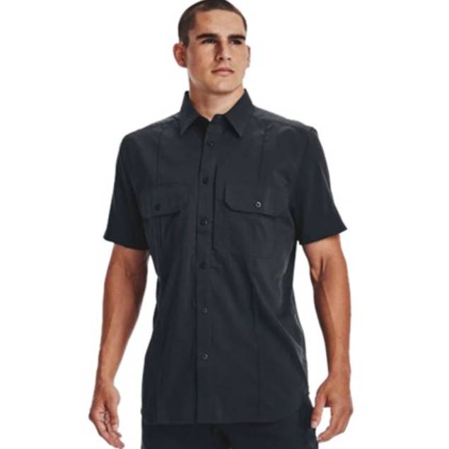 A man is wearing a short-sleeve black button-up shirt with two chest pockets.