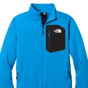 Blue jacket with black chest pocket, full zip, and The North Face logo on the pocket.