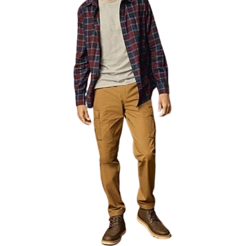Men's cargo pants in a tan color, featuring large side pockets. They are worn with brown boots and paired with a gray t-shirt and a navy and red plaid shirt.