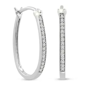 Elegant hoop earrings feature a slim, elongated design, each adorned with a row of sparkling diamonds, totaling 1/4 carat. The earrings are set in a polished, silvery metal, providing a sleek and sophisticated look.