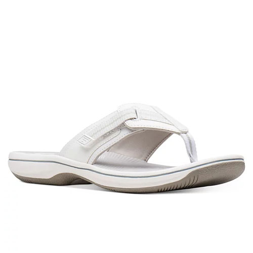 Brinkley Jazz Sandals are white flip-flops with a cushioned footbed, textured straps, and a durable sole designed for comfort and grip.