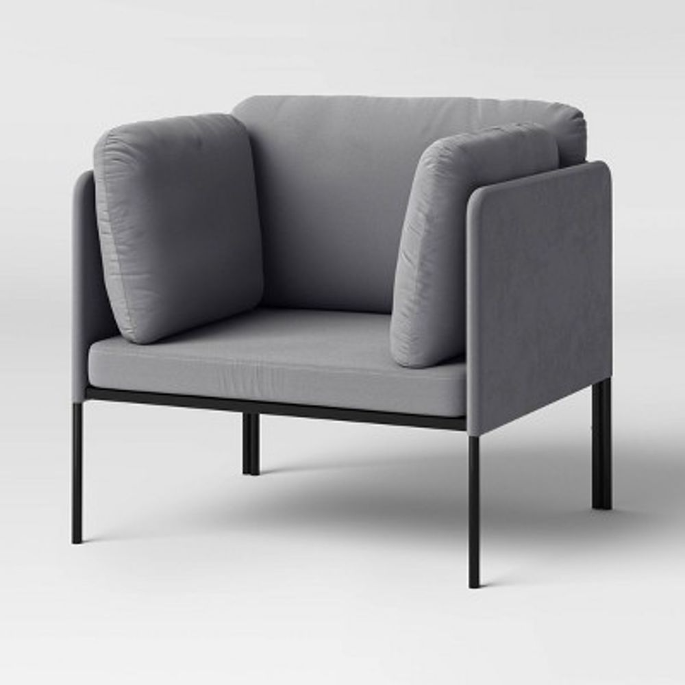 A modern gray armchair with a minimalist design, featuring cushioned sides and backrest on a slim black metal frame.