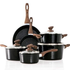 A set of black cookware with wooden handles, including pots with lids and frying pans.