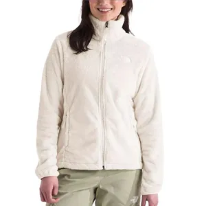 The North Face Osito Fleece Jacket is a soft, cream-colored jacket with a full front zip and stand-up collar. It features zippered pockets and is designed for warmth and comfort.
