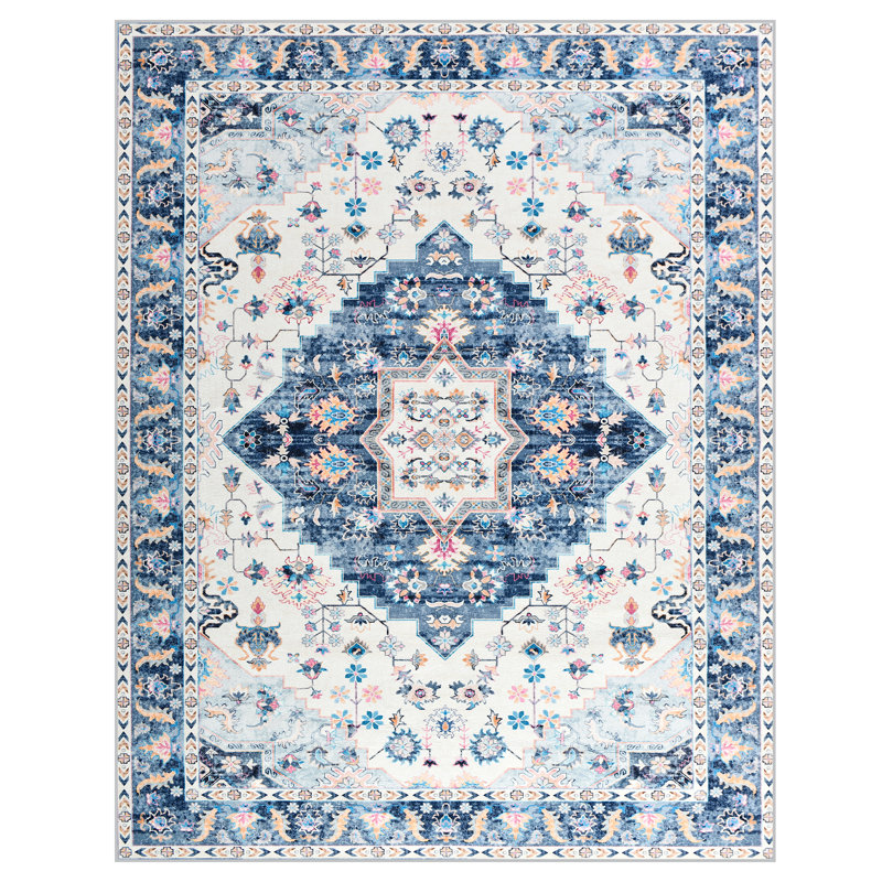 5' x 8' Shivank Area Rug features a detailed design with a central medallion and intricate floral and geometric patterns in blue and white tones, surrounded by ornate borders.