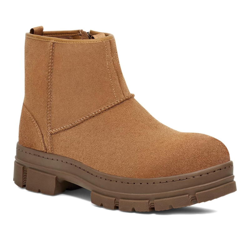 UGG Skyview Waterproof Zip Boots feature a tan suede exterior, chunky rubber sole, and side zipper for easy access, designed for durability and style in wet conditions.