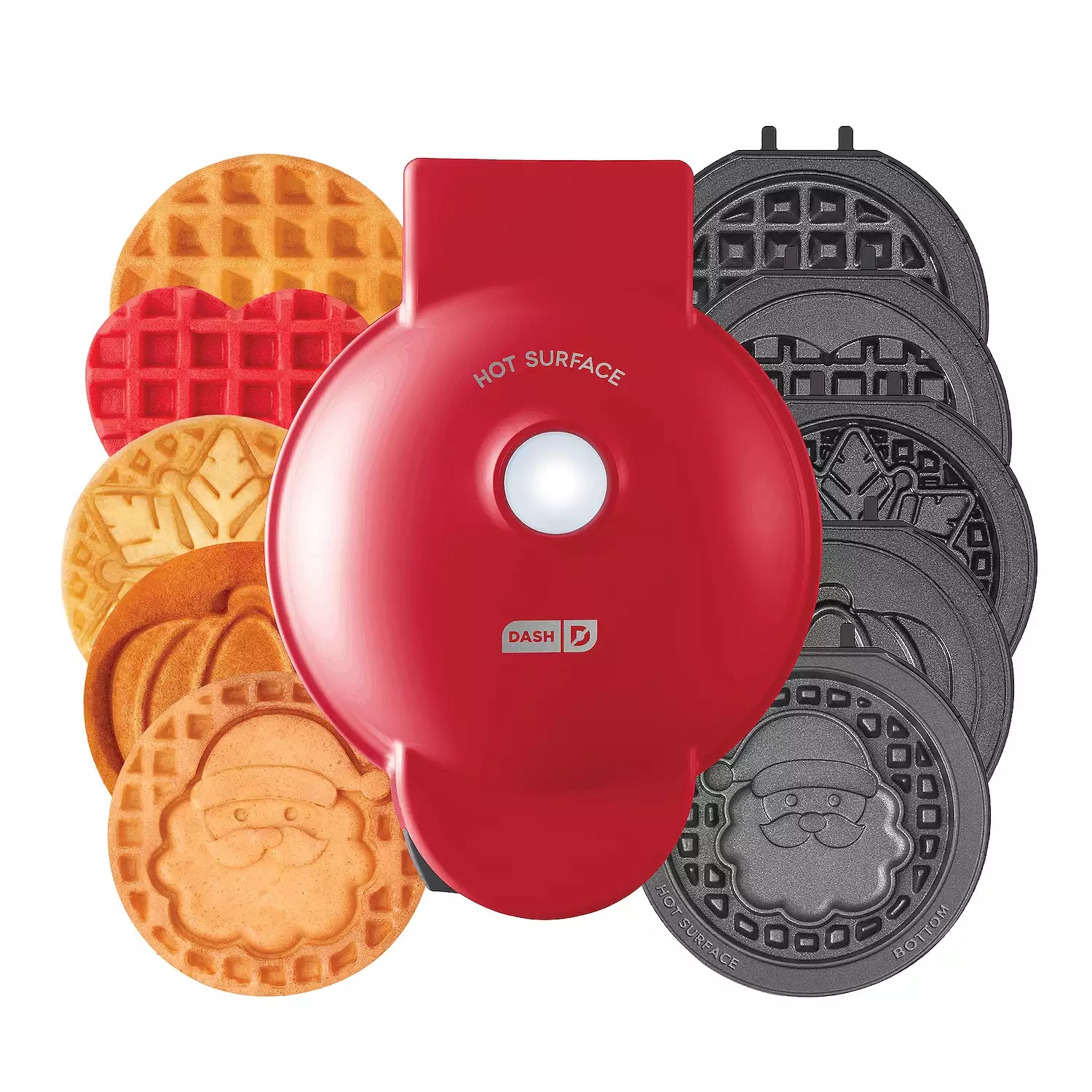 A red, circular Dash waffle maker with interchangeable plates to create different holiday-themed waffles, including patterns like snowflakes and gingerbread men.