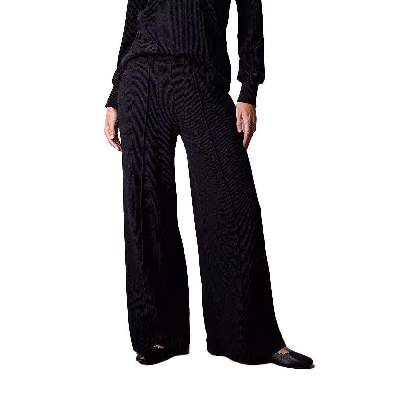Black high-rise knit pants with a wide-leg design and a textured pattern, featuring a drawstring waist and side pockets.