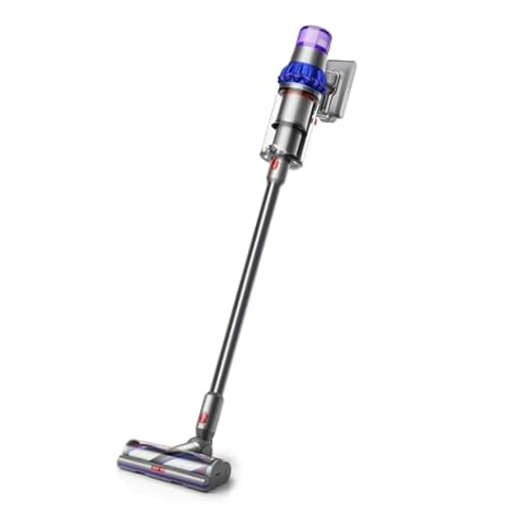 A cordless stick vacuum cleaner with a sleek design and a detachable dustbin, featuring a combination of metal and plastic components in purple, silver, and red accents.