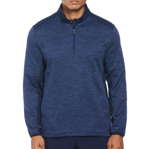 A man wearing a blue, zippered half-pullover with a textured pattern.