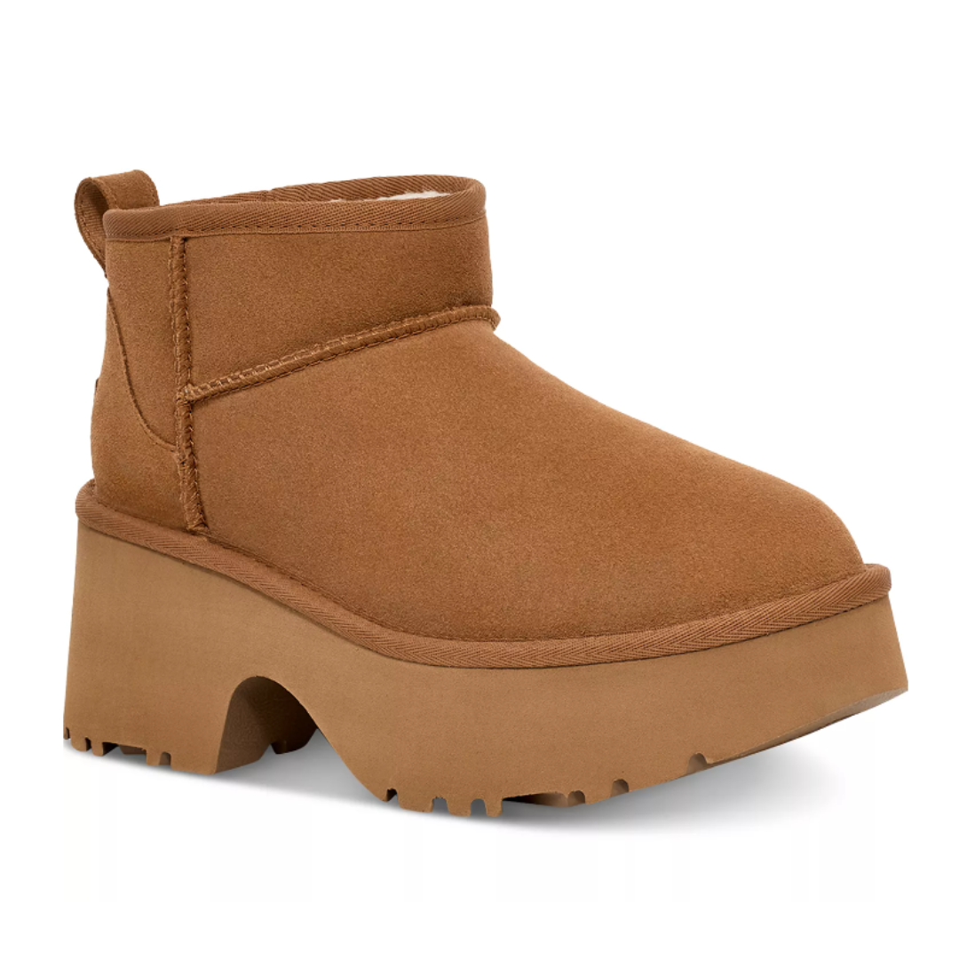 Brown platform ankle boot with suede finish, featuring a chunky sole and pull tab at the heel.