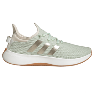 A light green Adidas sneaker with metallic stripes, featuring a white Cloudfoam sole and a gum outsole.