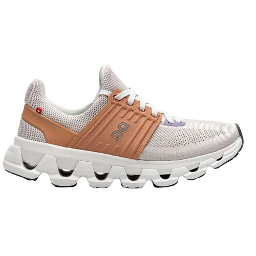 A white and brown athletic shoe with mesh fabric and distinctive cushioned sole, featuring a unique lacing system and a small circular logo on the side.
