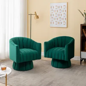 Two green velvet armchairs with a tufted design, set against a neutral room backdrop.