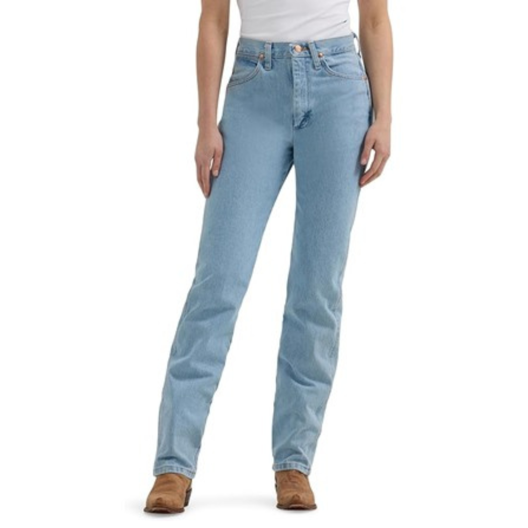 Light blue straight-leg jeans paired with tan ankle boots and a white top, modeled by a person.