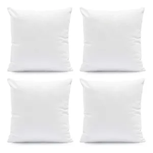 Four white square pillows on a plain background, arranged in a 2x2 grid.