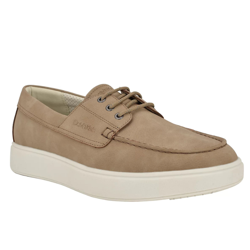 A tan casual lace-up shoe with a white sole and stitched detailing, featuring a subtle brand logo on the side.
