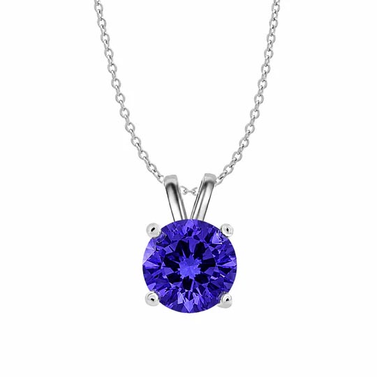 A necklace with a silver chain features a round, deep blue gemstone in a simple pendant setting.