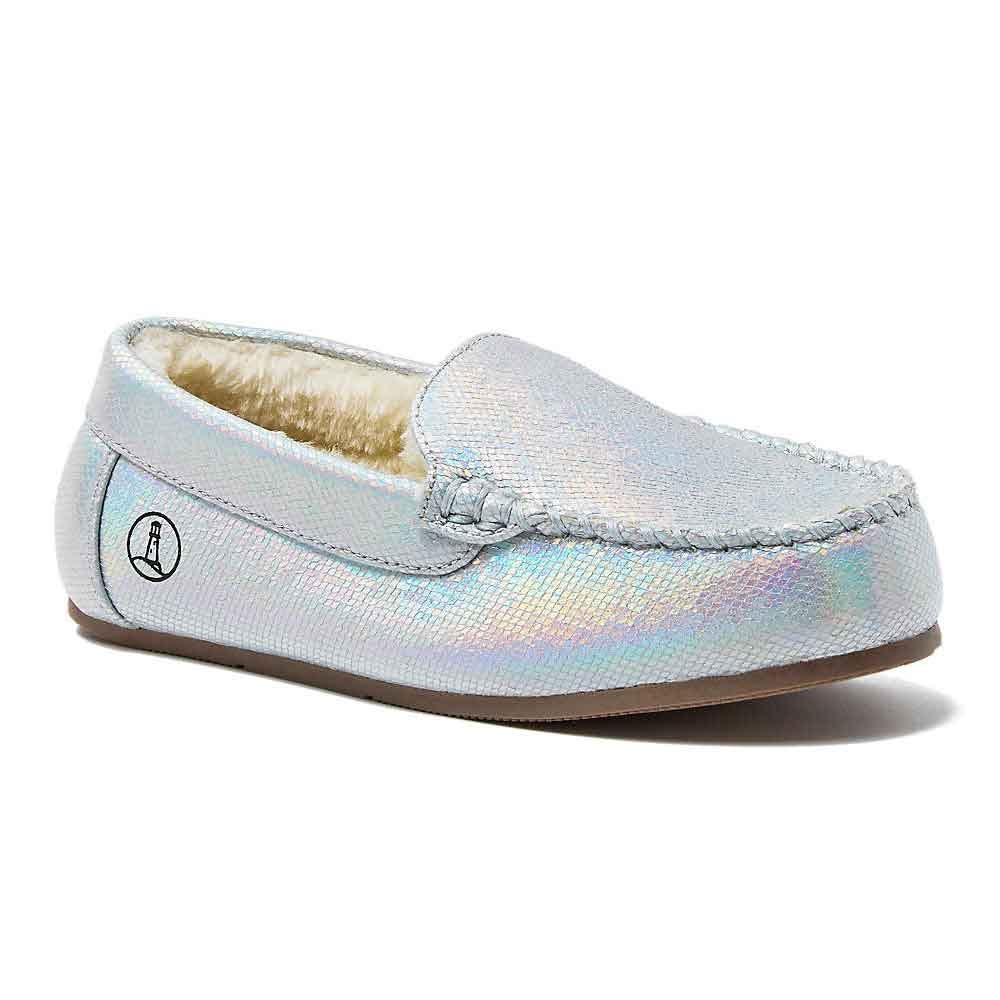 Iridescent moccasin-style slipper with plush interior and a distinctive circular logo on the side.