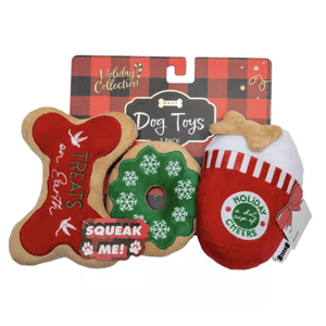 Holiday-themed dog toys pack with three items: a bone-shaped toy with \“Treats on Earth,\“ a green snowflake-covered donut, and a stocking-shaped toy labeled \“Holiday Cheers,\“ all featuring a squeaker inside.