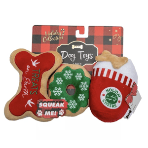 Holiday-themed dog toys pack with three items: a bone-shaped toy with \“Treats on Earth,\“ a green snowflake-covered donut, and a stocking-shaped toy labeled \“Holiday Cheers,\“ all featuring a squeaker inside.