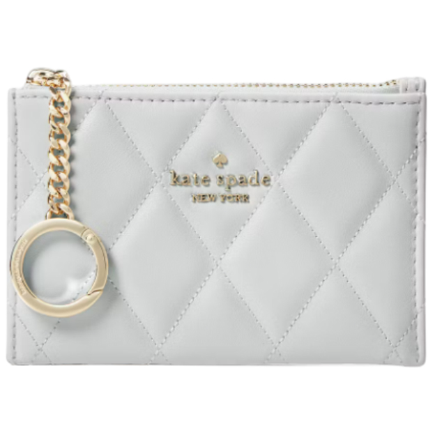 A quilted leather cardholder with a zip closure, gold chain, and keyring, featuring the Kate Spade New York logo in gold.