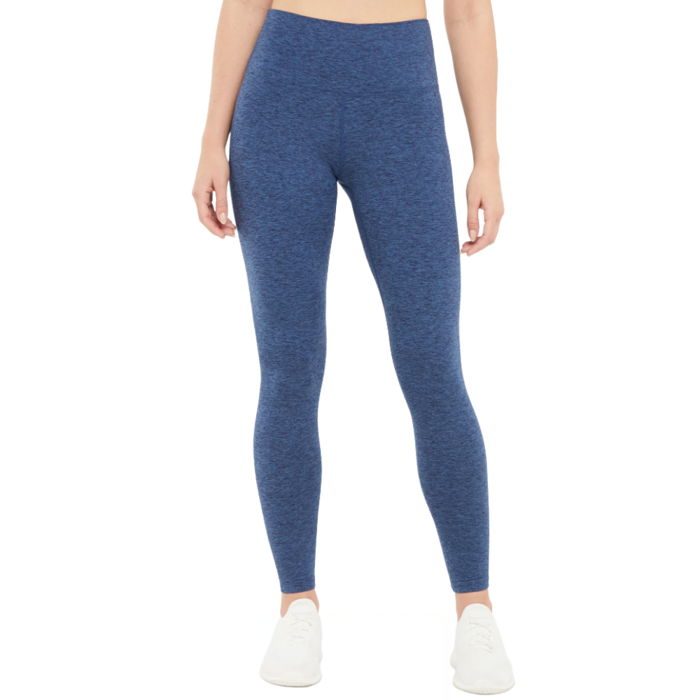 Blue high-waisted leggings paired with white sneakers.