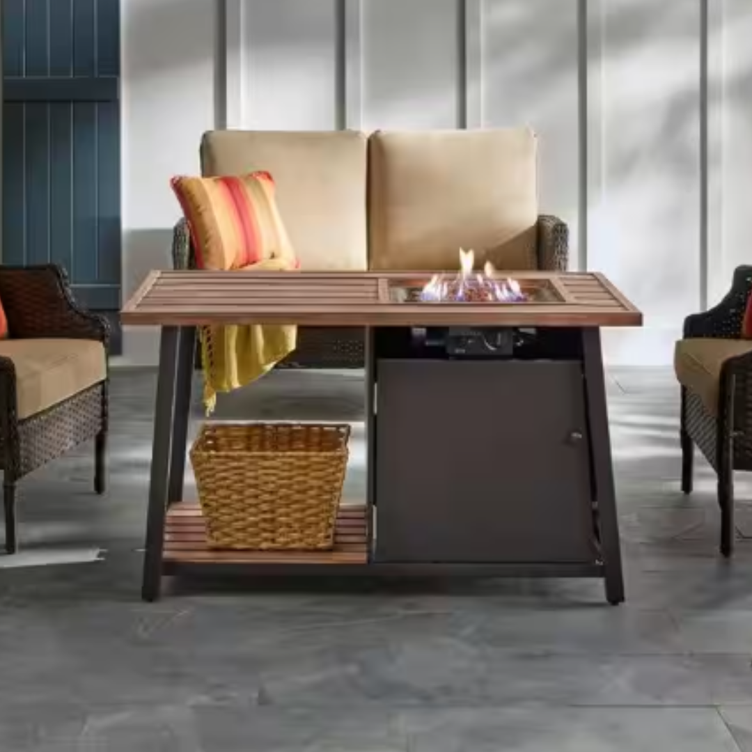 Patio fire pit table, wicker armchairs, and decorative basket.