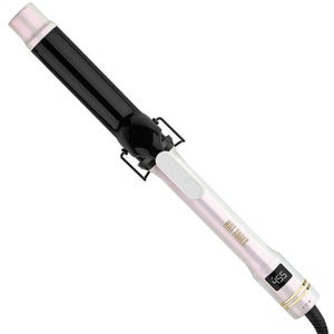 A Hot Tools Pro Curling Iron with a sleek black and white design features a digital temperature display set to 455°F. The barrel is made of ceramic, and it includes an ergonomic handle and supportive stand.