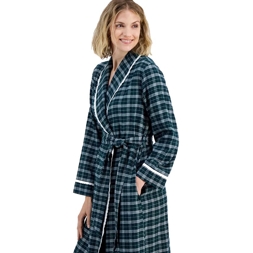 A woman is wearing a plaid robe with a belted waist and white trim on the collar and cuffs.