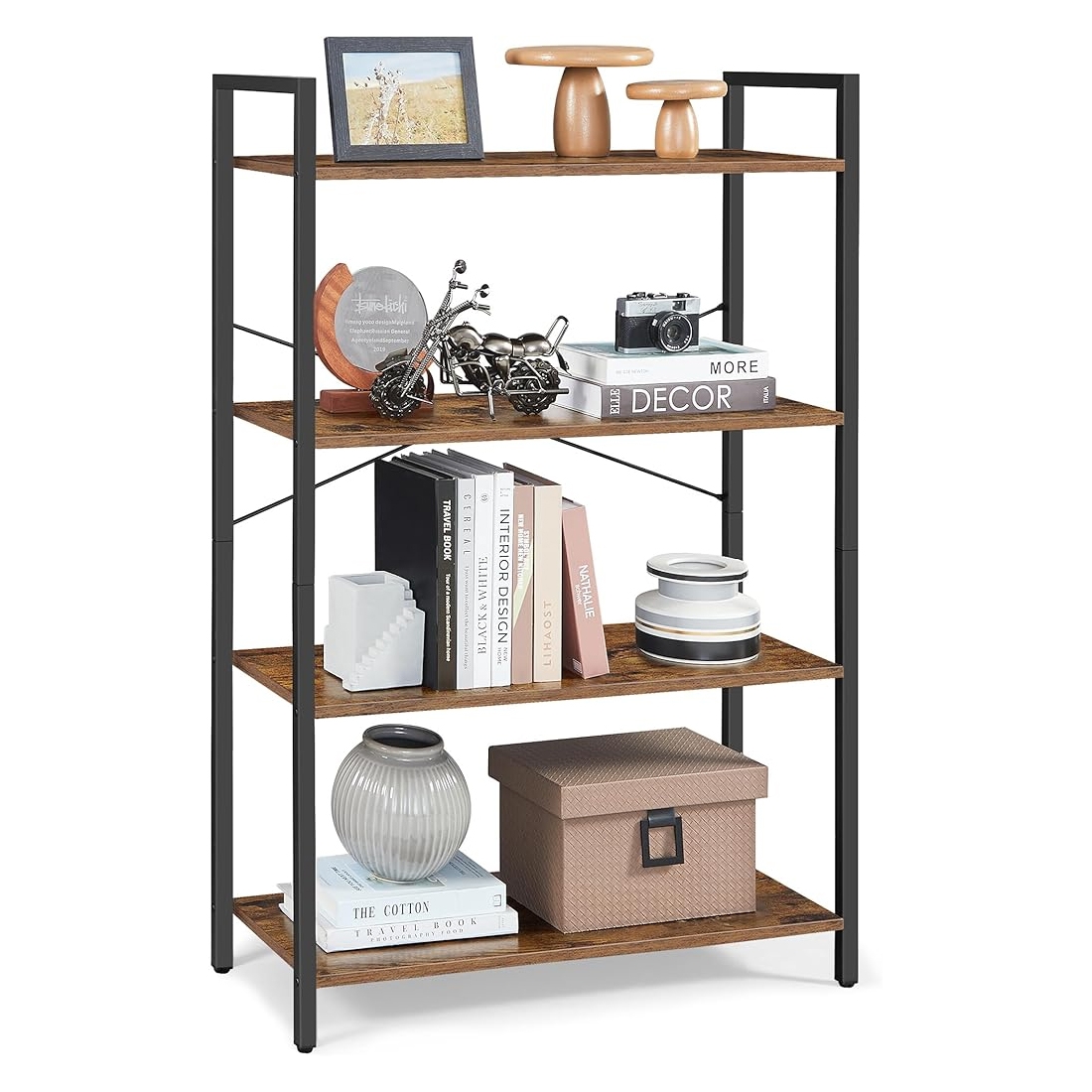 A 4-tier bookshelf with a black metal frame and wooden shelves displays various decor items: framed photo, decorative mushrooms, mini motorcycle, camera, books, canisters, a vase, and a storage box.