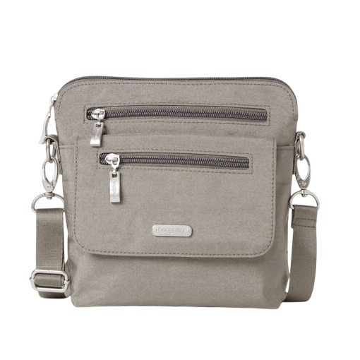 Gray crossbody bag with two front zippered pockets, adjustable strap, and metal hardware accents.