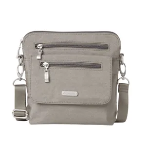Gray crossbody bag with two front zippered pockets, adjustable strap, and metal hardware accents.