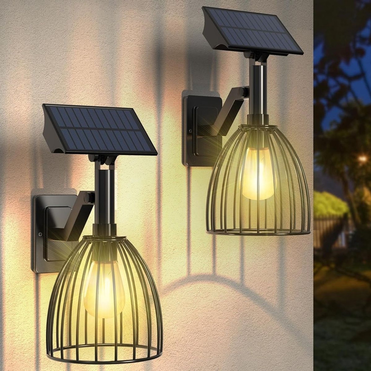 Two outdoor wall lanterns with a solar panel on top and a cage-style design, each emitting a warm light, mounted on a wall.