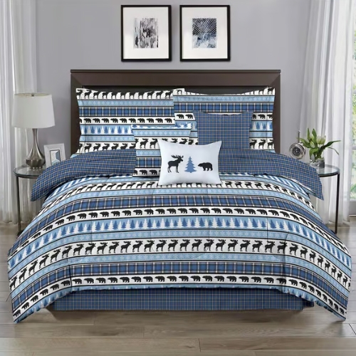 Bedding set featuring a rustic theme with patterns of bears and trees on a blue and white background, including a comforter, pillows, and shams, complemented by a plaid design.