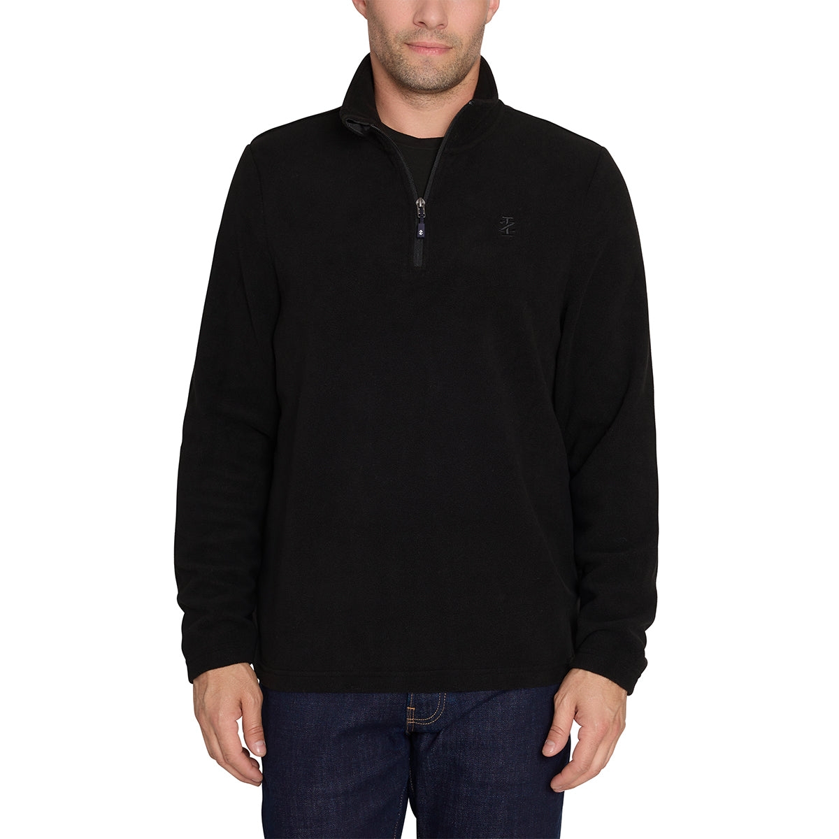 A man is wearing a black Izod pullover fleece with a half-zip closure and a subtle logo on the left chest. He's paired it with dark blue jeans.