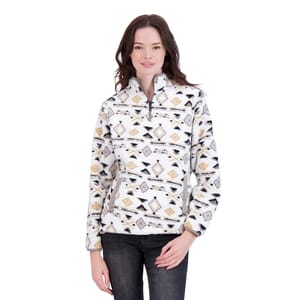 A woman wearing a patterned pullover fleece jacket with a geometric design, featuring a front zipper and side pockets, paired with dark jeans.