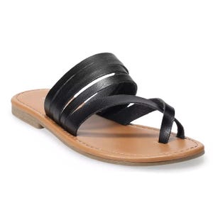 The Sonoma Cressida Sandals feature multiple black leather straps and a toe loop, with a tan footbed and a flat sole.