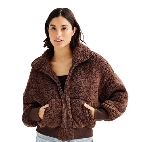Brown sherpa bomber jacket with a front zipper and large collar, complemented by two front pockets and ribbed cuffs.
