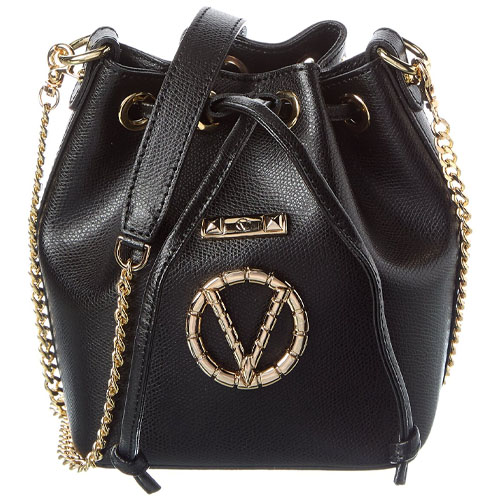 Black bucket bag with gold chain straps and gold circular emblem on front.