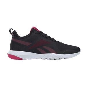 Black athletic shoe with a white sole and pink accents, featuring a mesh-like upper and a pull tab on the heel.