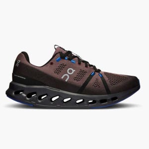 A brown running shoe with blue accents and a distinctive hollowed-out sole design.