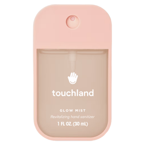 Touchland Glow Mist, a revitalizing hand sanitizer, 1 fl oz (30 mL), with a peach-pink casing.