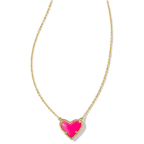 A gold chain necklace featuring a heart-shaped pendant in bright pink, bordered with small crystals.