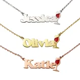 Three name necklaces in different metal tones (silver, gold, rose gold) featuring the names \“Jessica,\“ \“Olivia,\“ and \“Katie,\“ each with a wine glass design.