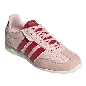 Adidas sneaker in light pink with red stripes and a white sole, featuring a classic, low-profile design.