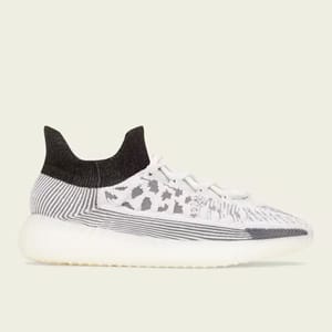 A pair of white and grey patterned knit sneakers with black ankle collars and a translucent sole.