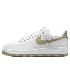 Nike Air Force 1 '07 Shoes feature a classic low-top silhouette with a white leather upper, olive green Swoosh, and matching heel and outsole accents. The perforated toe box and cushioned midsole offer breathability and comfort.
