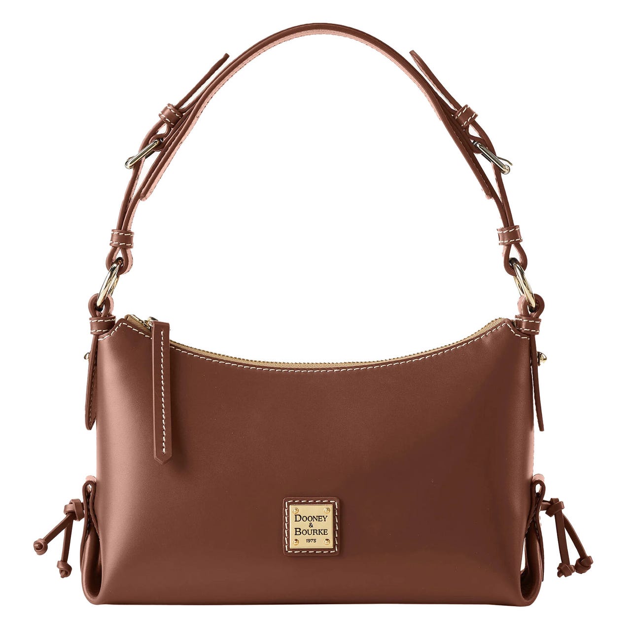 Brown Dooney & Bourke hobo bag with a smooth finish, features a zip closure, adjustable knotted strap, side tassels, and a gold-tone logo plaque.