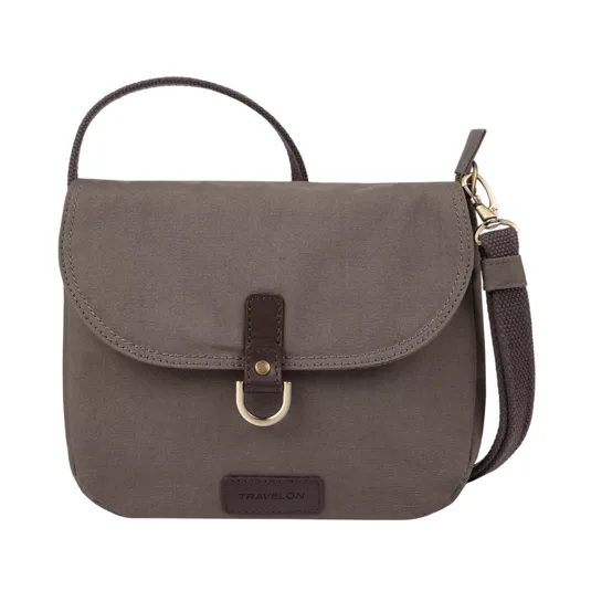 A compact, brown crossbody bag with a flap closure, featuring a strap, metal accent, and the brand name \“Travelon\“ on the front.